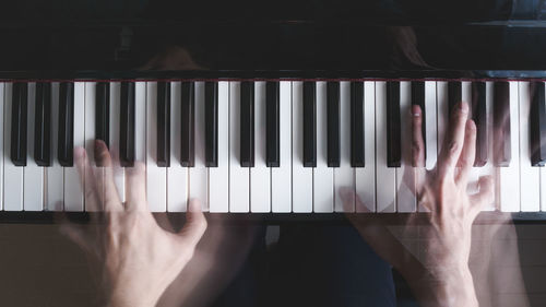 Blurred motion of man playing piano