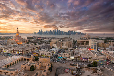 Aerial view of doha skyline with fanar mosque at sunset time