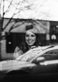 Smiling young woman in cafe