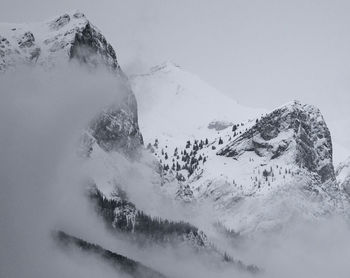 Scenic view of snow covered mountains against sky