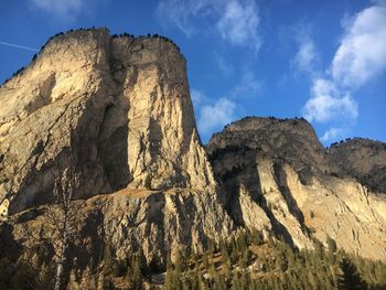 Low angle view of rock formation against sky