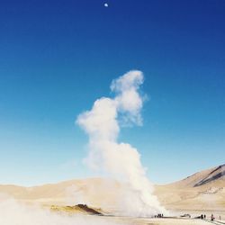 View of hot spring against blue sky