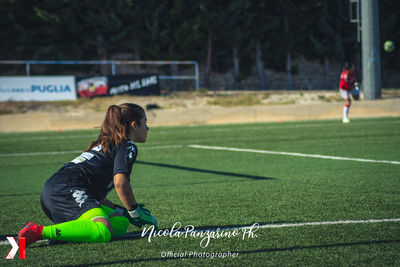 Full length of senior woman on soccer field