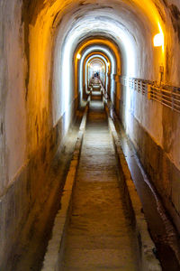 Man in illuminated tunnel