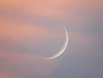 Low angle view of moon against sky at night