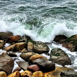 High angle view of pebbles at sea shore