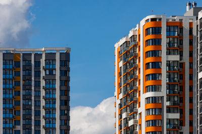 Low angle view of modern buildings against sky