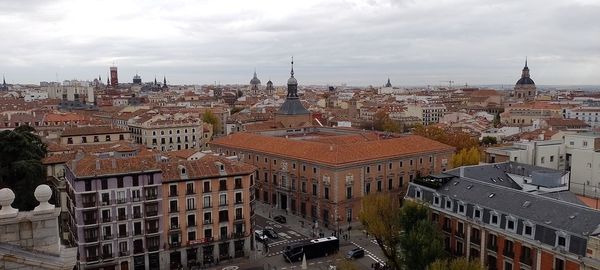 High angle view of buildings in city against sky