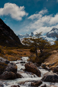 Scenic view of snowcapped mountains against sky