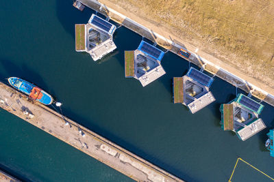 High angle view of swimming pool in canal by buildings