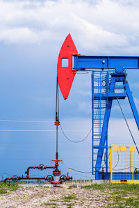 Extraction of crude oil in oilfield. oil drilling rig pumps oil. petroleum industry