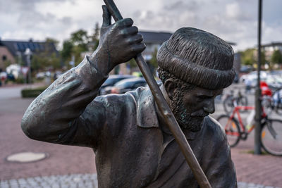 Close-up of statue on city street