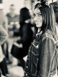 Portrait of a smiling young woman outdoors