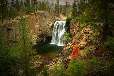 View of waterfall along rocks