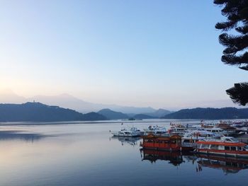 Scenic view of lake and mountains against clear sky