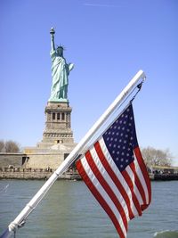 Close-up of statue against blue sky