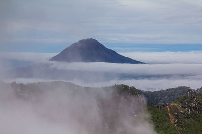 View of clouds over mountain