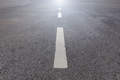 High angle view of arrow sign on road