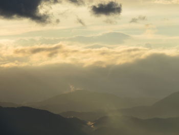 Scenic view of landscape against cloudy sky