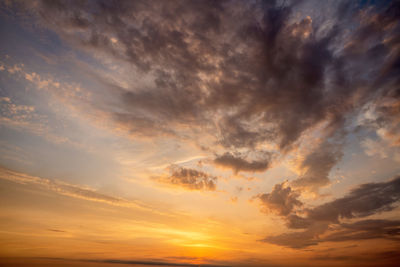 Low angle view of dramatic sky during sunset