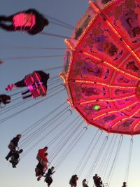 Low angle view of ride against clear sky