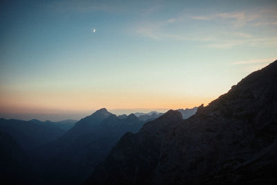 Scenic view of mountains against sky during sunset