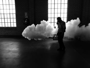 Person fogging a building