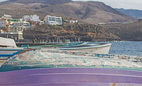 Some overturned boats on the beach.