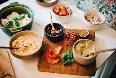 High angle view of food served on dining table in party at home