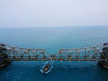 View of suspension bridge over sea