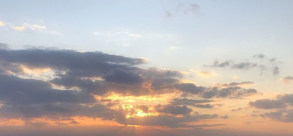 Low angle view of clouds in sky during sunset