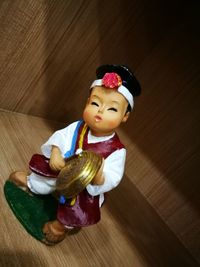 Close-up of baby girl on table