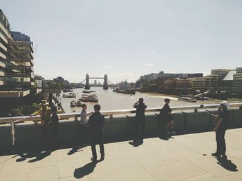 People in city against clear sky