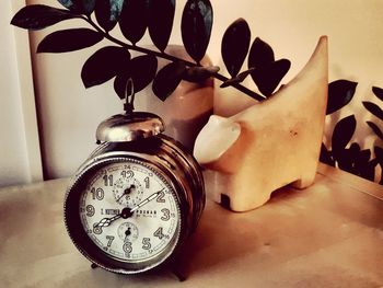 Close-up of clock on table