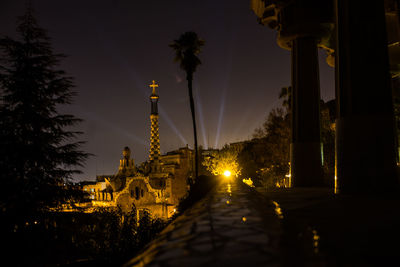 Illuminated building against sky at night