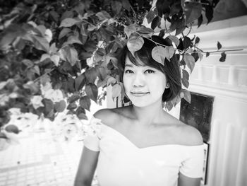 Close-up portrait of young woman standing outdoors