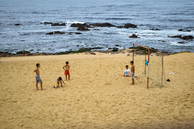 Group of people playing on beach