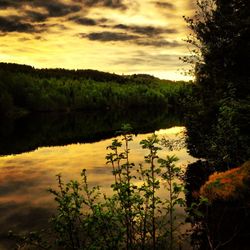 Scenic view of lake at sunset