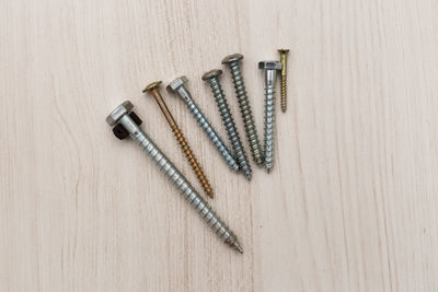 High angle view of screw on table