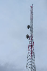 Low angle view of communications tower against sky