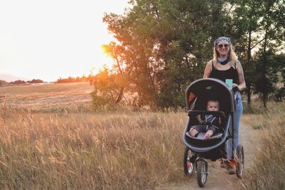 A mother and son going for an evening walk.