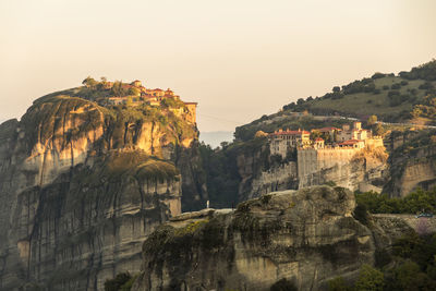 Rock formations on mountain against clear sky