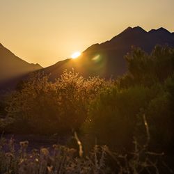 Scenic view of mountains against sky during sunset