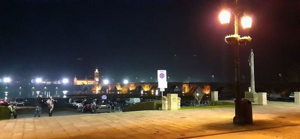 Illuminated buildings in city at night