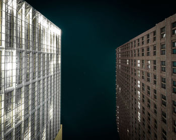 Modern building against sky at night