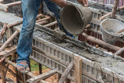 Low section of men working at construction site