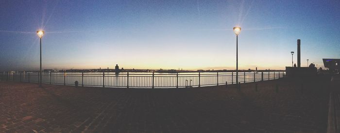 Scenic view of sea against clear sky during sunset