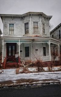 Building covered with snow against sky