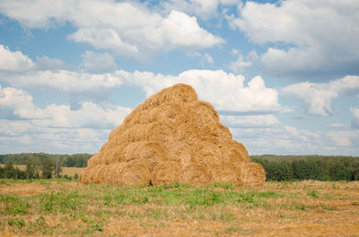 Landscape with bales of straw in summer, stubble field.