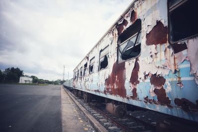 Train on railroad tracks against sky